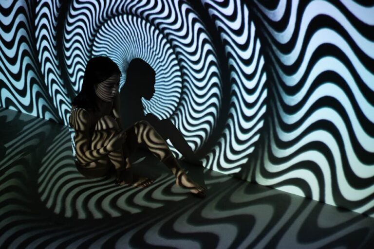 illuseum berlin - A mysterious and surreal scene featuring a woman sitting in a wavy optical illusio